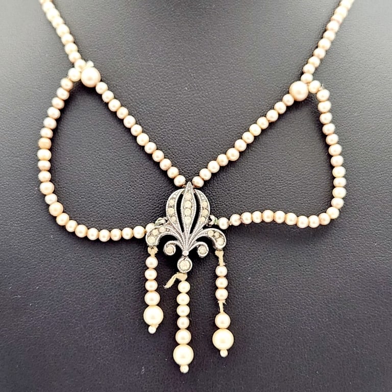 Antique Sterling Fleur-de-lis & Pearl Necklace Necklace is: Necklace is 16". One of the pearls is missing, see pictures. Weighs 15.6 grams.