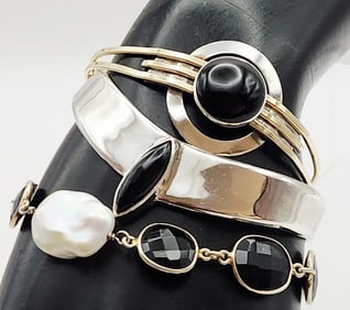 Lot of 3 Sterling & Vermeil Cuff Bracelets Onyx Mother-of-Pearl Lot weighs 50.1 grams.