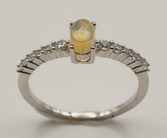 Rhodium Plated 925 Sterling Opal & Cubic Zirconia Ring Size 7.75. Weighs 1.6 grams.