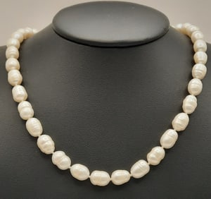Freshwater Cultured Ring Pearl Necklace Necklace is 18". Weighs 43.3. Clasp is 14K.