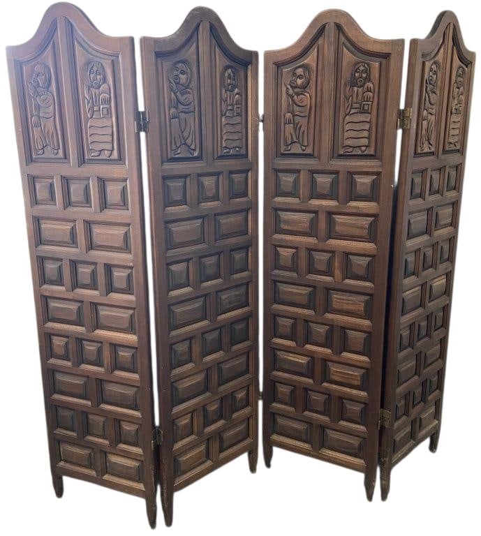 Carved Wood Room Divider Dark wood room divider carved with medieval figures. Hinge in the center is: Dark wood room divider carved with medieval figures. Hinge in the center is loose making the divider two piece. Some scrapes and scratches to the wood. Divider is 67 inches tall, each two piece sectio
