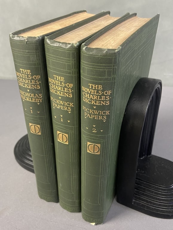 Antique Charles Dickens Books Set of Three London Edition published by The Caxton Publishing: London Edition published by The Caxton Publishing Company, circa 1900. Titles include The Pickwick Papers 1 and 2 and Nicholas Nickleby 1. Lovely green art deco style covers.