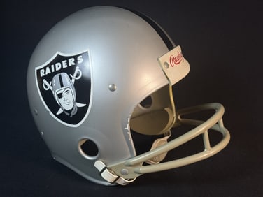 Vintage Rawlings Oakland Raiders Full Size Helmet Size large. 2 bar. Scuffs and scratches present