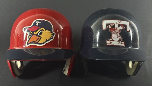 Toledo Mud Hens Batting Helmets Size 7 1/8 and 7 1/4. Signs of age and wear overall. See photos for