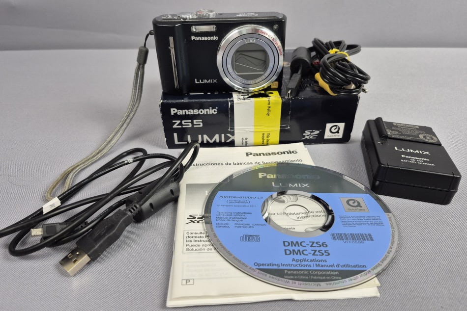 Panasonic LUMIX DMC-ZS5 Digital Camera & Accessories Ser NO FM0CA007209 with Box: Accessories Ser NO FM0CA007209 with Box Powers on, otherwise untested. Scratch on screen. Please see images for details regarding the condition.
