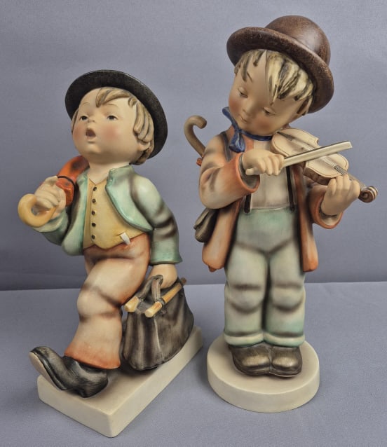 Goebel Hummel Figurines Little Fiddler Boy & Merry Wanderer: Merry Wanderer Fiddler boy 13 inches tall, small chip on rim of base. Merry wanderer 11 inches tall, crazed, small chips in paint on leg and shoe. Please see images for details regarding the condition