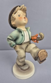 Goebel Hummel 8" Happy Traveler Figurine Very small paint chips. Chip around rim on bottom. Please