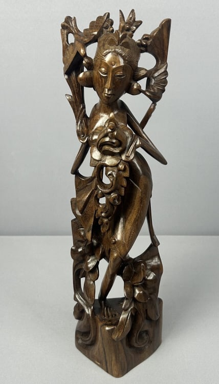 Balinese Hand Carved Wooden Statue Hand carved wooden statue of Ni Bawang with birds. Unmarked in: Hand carved wooden statue of Ni Bawang with birds. Unmarked in excellent condition. 17 inches tall and 5 inches wide.