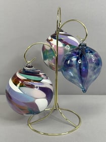 Handblown Glass Ornaments & Brass Stand Three multi colored glass ornaments, two orbs and one heart