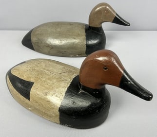 Two Hand Carved Wooden Ducks Made in Michigan Handcarved pair of wooden ducks, marked Primitive
