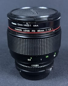 Canon FD 85mm f/1.2 L Manual Prime Lens Made in Japan. With high end caps. Untested. 4 x 2.5 inches.