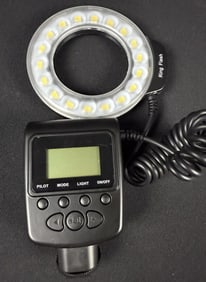 ProMaster RL-100 Ring Flash Camera Speedlite With filters and carry bag measuring 10 x 3 x 6 inches.