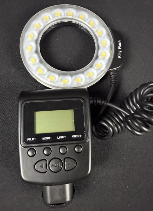 ProMaster RL-100 Ring Flash Camera Speedlite With filters and carry bag measuring 10 x 3 x 6 inches.: With filters and carry bag measuring 10 x 3 x 6 inches. Powers on, otherwise untested