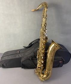 Buescher Saxophone with Case Saxophone with mother of pearl buttons on valves, marked Elk Hart Built
