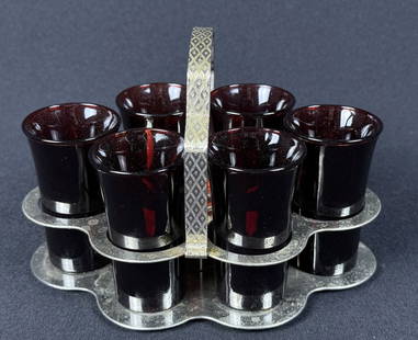 Vintage Mid Century Ruby Red Shot Glass Set 6 Glasses with caddy. Free from damage. Glasses each: 6 Glasses with caddy. Free from damage. Glasses each measure approximately 2.75 x 1.5 inches. Caddy 7 x 4.5 x 4.5 inches.
