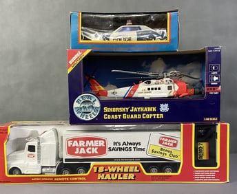 Three Vintage Toy Vehicles in Original Packaging Radio Shack Programmable Police Car, Sikorsky