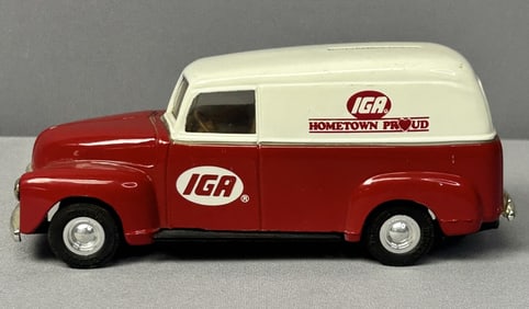 Diecast Coinbank Truck Diecast model of a 1950 Chevrolet panel truck that functions as a coinbank.