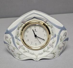 Lladro Porcelain Table Clock Running when cataloged No visible chips, cracks or repairs.