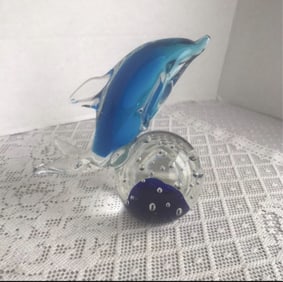 Art Glass Blue Dolphin Figurine Pretty glass dolphin balancing on a ball.