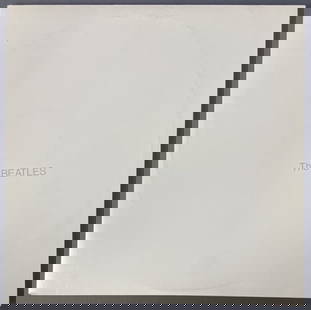 Vinyl Beatles White Album with Poster The Beatles SWBO 101, Capital Records. Includes poster and: The Beatles SWBO 101, Capital Records. Includes poster and four Beatles portrait pictures, still attached to one another. Includes paper sleeves, gatefold, vinyl sold untested.