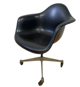 Eames Henry Miller Fiberglass Arm Chair Black molded swivel chair on aluminum wheeled base, marked