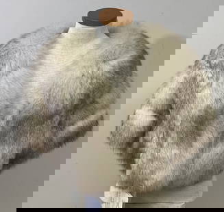 Blue Fox Fur Stole Wolverine Fur Co Fox fir stole with pockets in the sides. Light staining on: Fox fir stole with pockets in the sides. Light staining on lining. Measurements lying flat are: Neck: 11 inches Length 16 inches Bust 24 inches.