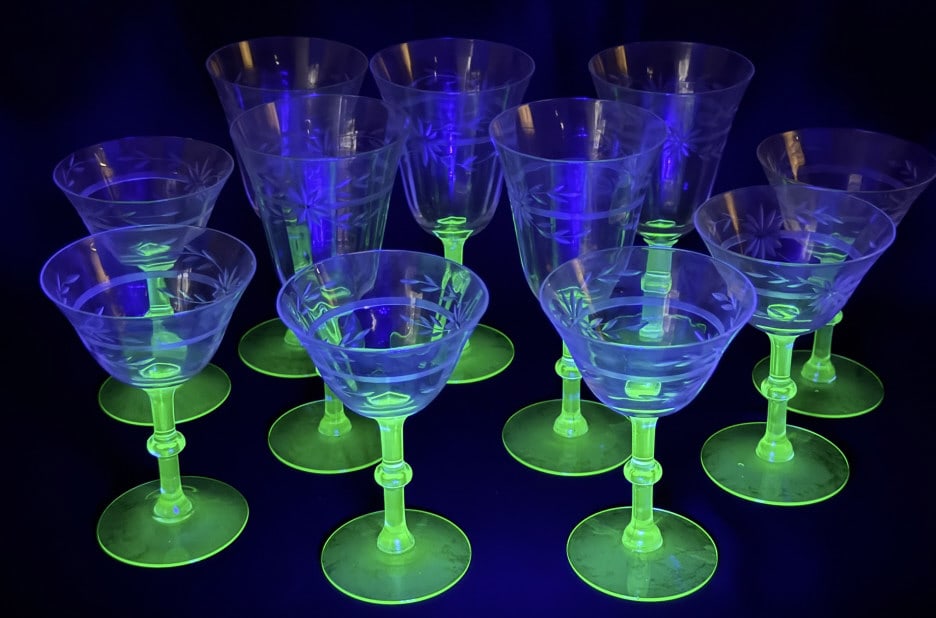 Vintage Uranium Glass Wine Goblets & Flutes 11 glasses total. 3 with chipped rims. Please see photos: 11 glasses total. 3 with chipped rims. Please see photos for further condition information. Approximately 10 x 12 x 6 inches total lot size.