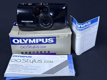 Olympus Stylus Zoom Film Camera Untested. With original box measuring 6 x 3 x 2.5 inches.