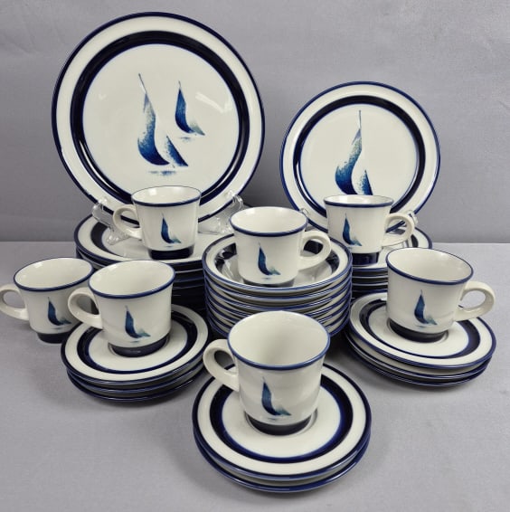 Noritake Stoneware Running Free 8968 Dinnerware: Set Includes 8 10.5 inch plates 7 8 inch plates 7 6 inch bowls 8 6 inch saucers and 7 cups Few utensil marks and stains. One cup has a chip. Please see images for details regarding the condition.
