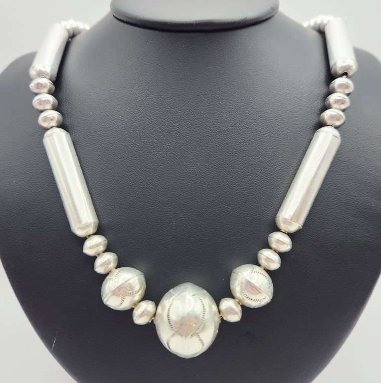 Navajo Sterling Pearl & Cylindrical Bead Necklace Necklace is: Necklace is 24". Weighs 51 grams. Unmarked, acid tested sterling.