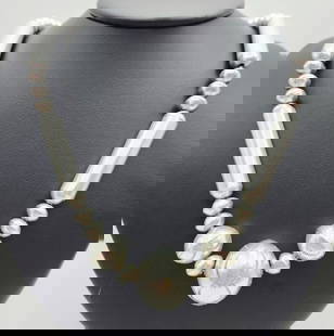 Navajo Sterling Pearl & Cylindrical Bead Necklace Necklace is: Necklace is 24". Weighs 51 grams. Unmarked, acid tested sterling.