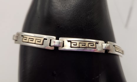 14K Gold & Sterling Bracelet Signed P. Skeet Bracelet is 8". Weighs 18.7 grams.