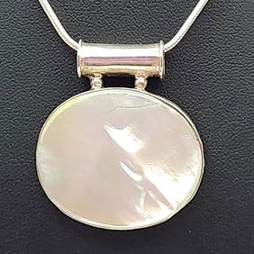 925 Sterling Silver Mother-Of-Pearl Necklace Necklace is 18". Weighs 20.8 grams.