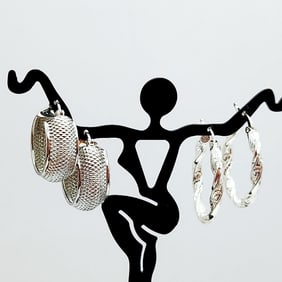 2 Pair 925 Sterling Silver Hoop Earrings Lot weighs 7.3 grams.