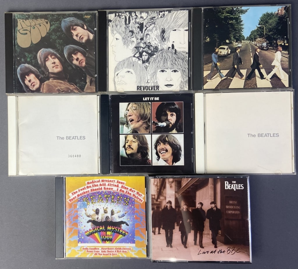 Beatles CD Set Lot of Eight 8 Beatles albums on compact disc. Titles include Rubber Soul, White: 8 Beatles albums on compact disc. Titles include Rubber Soul, White Album (2), Live at the BBC, Abbey Road, Revolver, Let it Be, and Magical Mystery Tour.