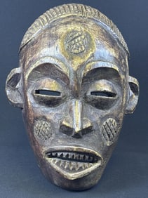 Decorative African Wooden Tribal Mask Measures approximately 14 x 12 x 7 inches. Please refer to