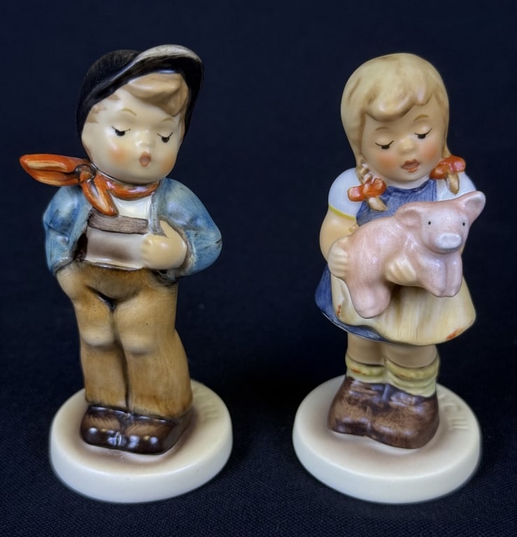 Hummel Figurines Pigtails & Lucky Fellow #2052 Pigtails stands 3.5 inches tall. #560 Lucky Fellow: #2052 Pigtails stands 3.5 inches tall. #560 Lucky Fellow 3.75 inches tall. Both with boxes. Free from damage.