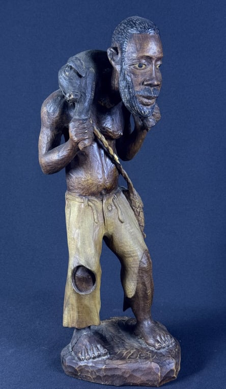 Carved Wooden African Statue Emile Jr Louis 19 inches tall by 7 x 7 inches. Crack in base.: 19 inches tall by 7 x 7 inches. Crack in base.