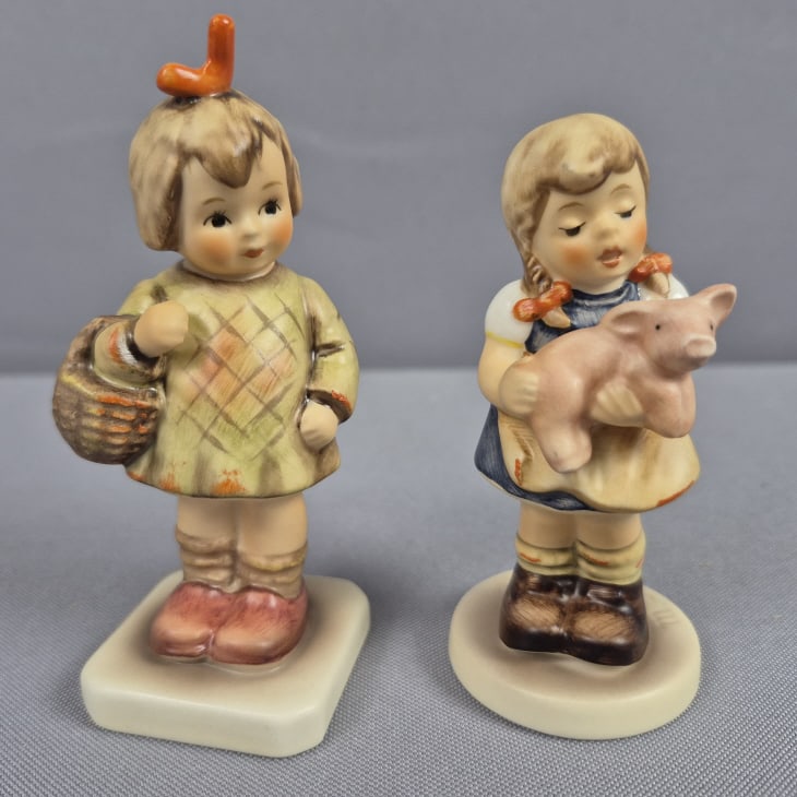 Goebel Hummel Figurines Pigtails 2052 & I Brought You a Gift: You a Gift 479 Pigtails measures 3.5 inches tall, TMK #7. I Brought You a Gift measures 4 inches tall, TMK #6. Both free from damage. Please see images for details regarding the condition.