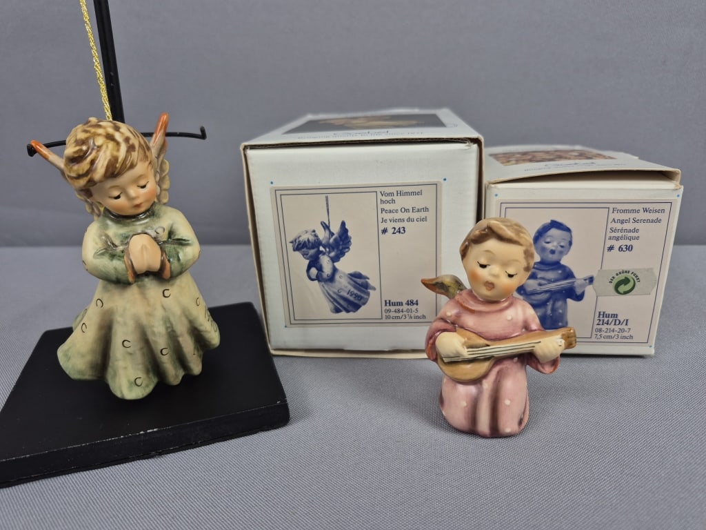 Goebel Hummel Figurines Peace on Earth 484 & Angel Serenade 214/D/I with Boxes: Angel Serenade 214/D/I with Boxes Peace on Earth measures 3.25 inches tall, TMK #6. Angel Serenade measures 3 inches tall, TMK #7. Both free from damage. Please see images for details regarding the co