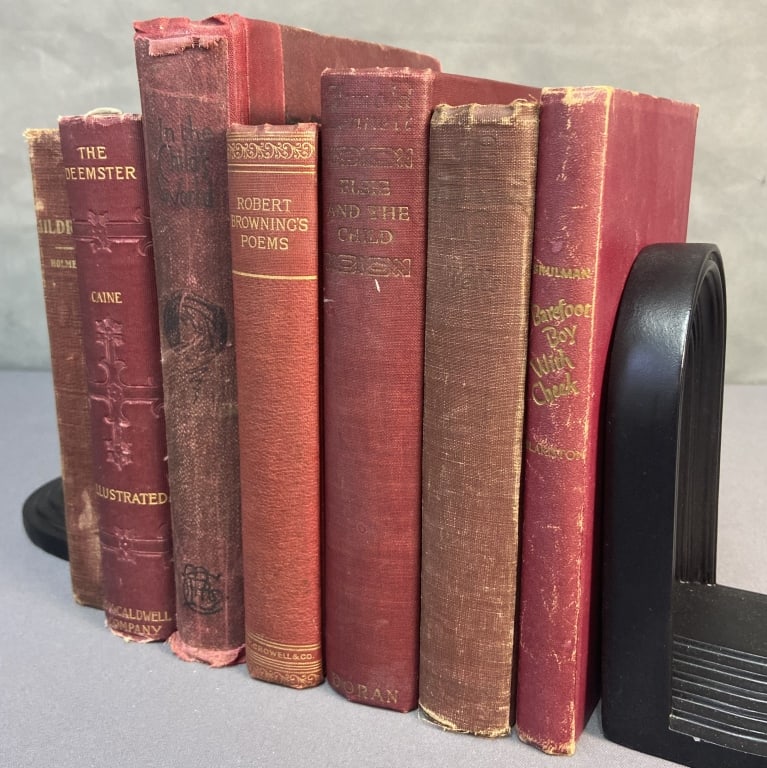 Red Covered Vintage & Antique Books Set of 7 The Deemster by Hall Caine. Published by HM Caldwell,: The Deemster by Hall Caine. Published by HM Caldwell, circa 1910. Loose pages, split in front end pages. Mildred by Holmes, published by The Mershon Company. Missing title and copyright pages. Split i