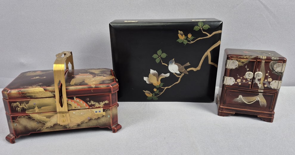 Trio of Vintage Japanese Lacquered Treasure Boxes One marked Maruni. No key. Larger one needs repair: One marked Maruni. No key. Larger one needs repair to hinge. Please see images for details regarding the condition.
