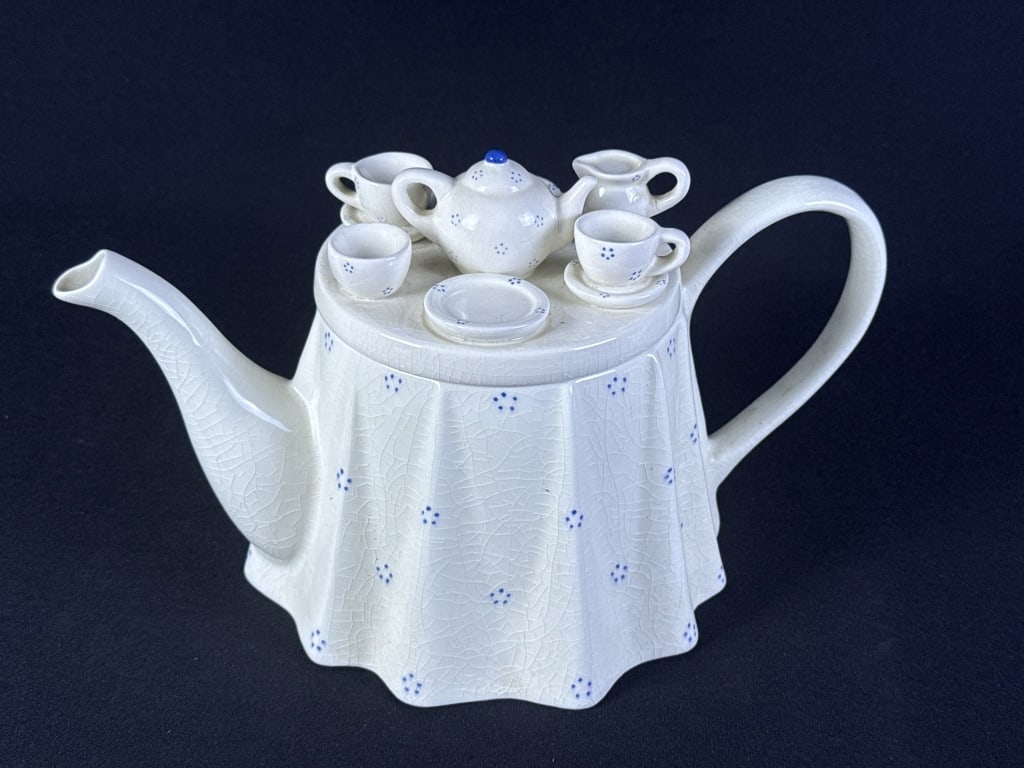 Vintage British Tea Council Teapot 12 inches wide by 6.5 inches tall. Crazing overall creamer handle: 12 inches wide by 6.5 inches tall. Crazing overall creamer handle on lid has been repaired.