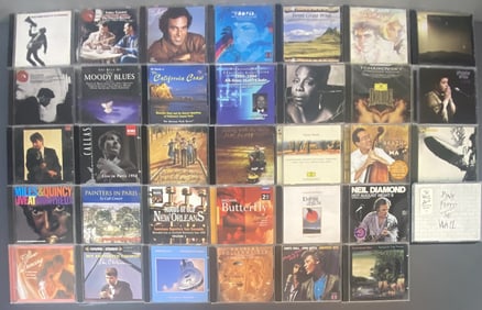 Mystery Compact Disc Lot Lot of 34 CDs including Pink Floyd, Fleetwood Mac, and others. Compact