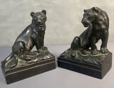 Paul Herzel Pompeian Bronze Lioness Bookends Two book ends made of bronze shaped like female lions.
