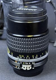 Nikon Nikkor 105mm f2.5 Lens With case, hood and caps.