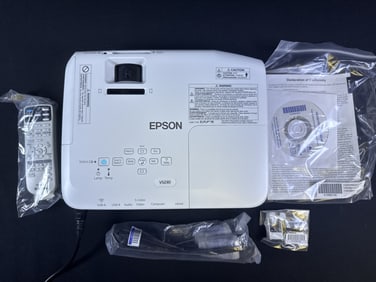 Epson VS230 Multimedia Projector Powers on. Lamp hours unknown. Includes original box, cords and