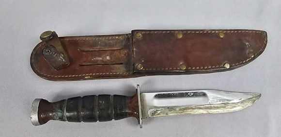 WW2 Military KaBar Knife with Sheath Blade measures 5.5 inches. Blade has been sharpened.
