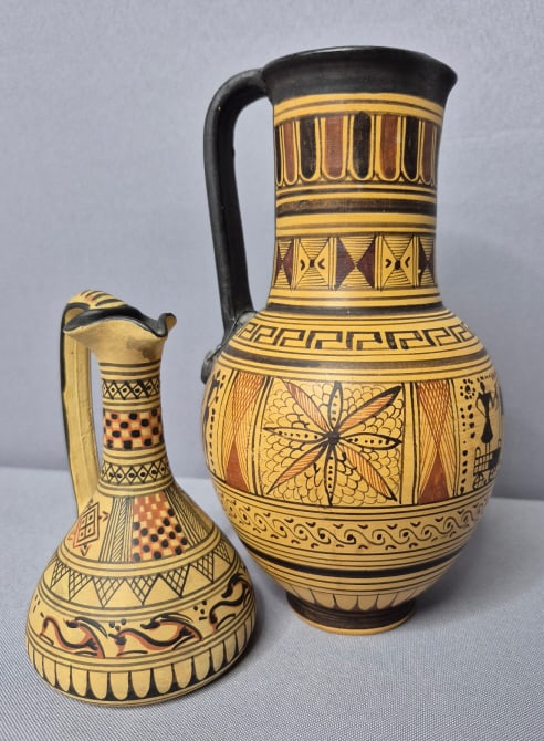 Pair of Vintage Replica Geometric Greek Art Amphora Ceramic Pitchers: Amphora Ceramic Pitchers Taller one is 7 inches tall. Shorter one is 4.5 inches tall. Both are free from damage. Please see images for details regarding the condition.