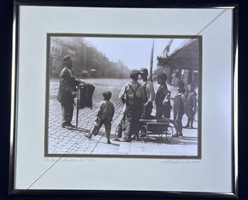 W.R. MacAskill Photograph The Organ Grinder Matted and framed (crack in glass) measuring 14.25 x